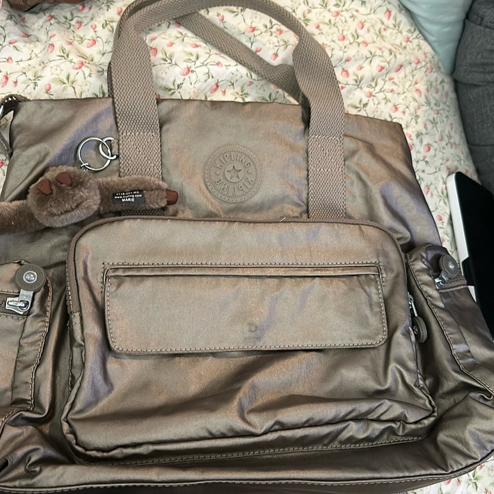 Kipling multi use backpack crossbody comes w/matching double pouch.
